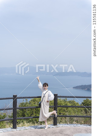 Woman looking at the sea Woman looking at the sea 135581136