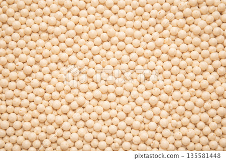 Texture background of densely packed pearl couscous grains 135581448