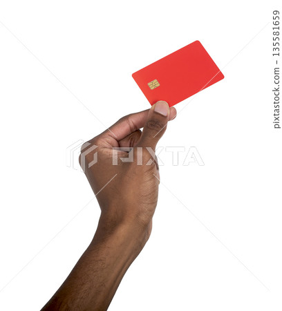 Hand holding red bank card with chip in raised position. Black skin male showing secure cashless Hand holding red bank card with chip in raised position. Black skin male showing secure cashless 135581659