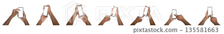 Hand holding smartphone with blank screen in mockup set. Black skin male using digital device for 135581663