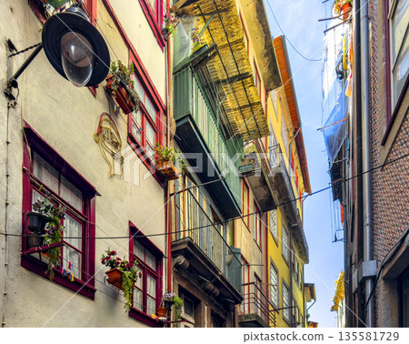 Porto, Portugal, May 20, 2025 Colorful close-up of old residential facades with green balconies, red Porto, Portugal, May 20, 2025 Colorful close-up of old residential facades with green balconies, red 135581729