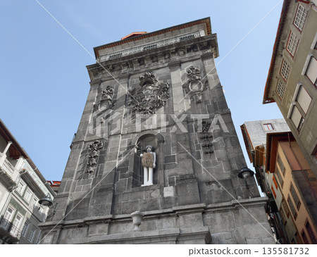 Porto, Portugal, May 20, 2025 Low angle view of historic stone building with ornamental facade, Porto, Portugal, May 20, 2025 Low angle view of historic stone building with ornamental facade, 135581732