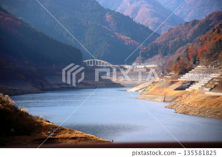 A bridge over the dam lake A bridge over the dam lake 135581825