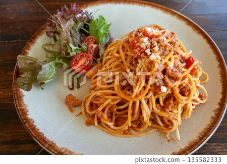 spaghetti and vegetable on ceramic plate 135582333