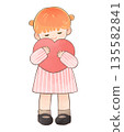 Smiling child girl hugging a heart 135582841