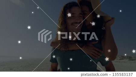 Carrying man taking dark swimsuit woman on piggyback at beach, with straw hat and star overlays Carrying man taking dark swimsuit woman on piggyback at beach, with straw hat and star overlays 135583137