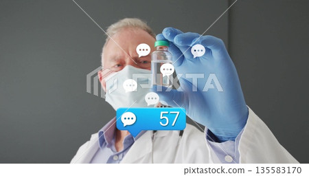 Inspecting doctor in lab coat holding vial at clinic, with floating chat bubbles message overlay 135583170