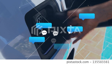 Inserting EV charging connector into car port at outdoor parking spot, with chat bubble overlay Inserting EV charging connector into car port at outdoor parking spot, with chat bubble overlay 135583381