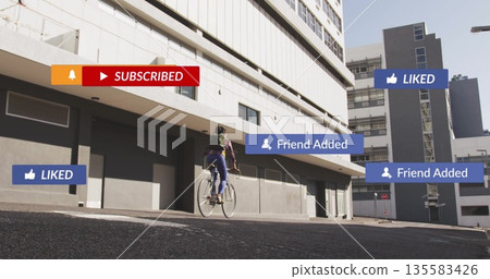 Riding Asian cyclist on bicycle wearing green jacket, blue jeans urban street, with floating icons 135583426