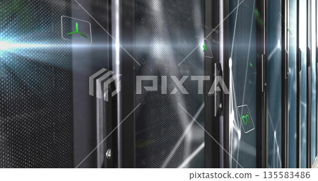 Showing perforated cabinet door displaying digital green propeller icon in server room, copy space 135583486
