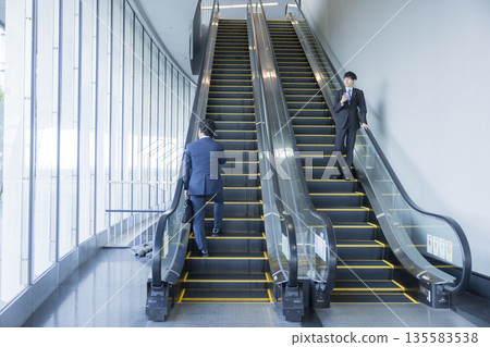 Escalator and businessman 135583538
