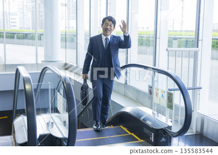 Escalator and businessman 135583544