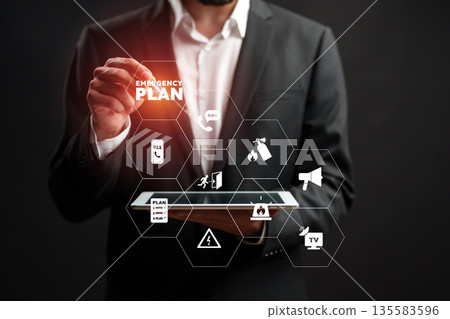 Creating an emergency plan in a business setting with a digital tablet Creating an emergency plan in a business setting with a digital tablet 135583596