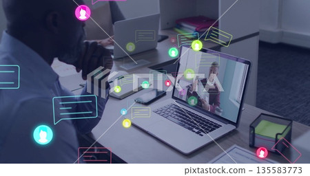 Mature man wearing light blue shirt joining meeting at office desk, with chat icons, copy space 135583773