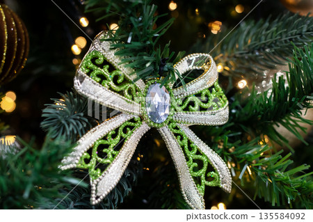 Elegant evergreen festive embellishment, Luxurious Christmas ornament with glittering accents Elegant evergreen festive embellishment, Luxurious Christmas ornament with glittering accents 135584092