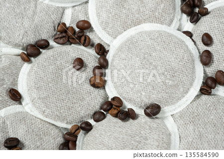 Coffee pads for brewing coffee in the coffee machine and scattering coffee beans 135584590