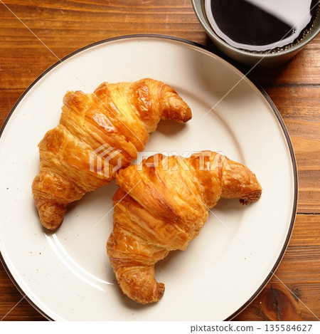 Croissants and coffee 135584627