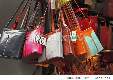 Rome, Italy - April 09, 2017: Handmade women bags sold  at the street market . Street shopping for handbags. 135584633