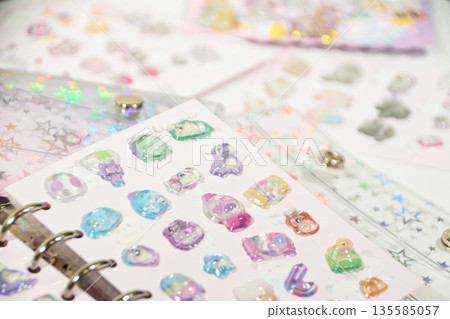 A sticker book filled with lots of stickers A sticker book filled with lots of stickers 135585057