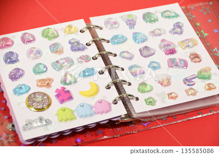 A sticker book filled with lots of stickers A sticker book filled with lots of stickers 135585086
