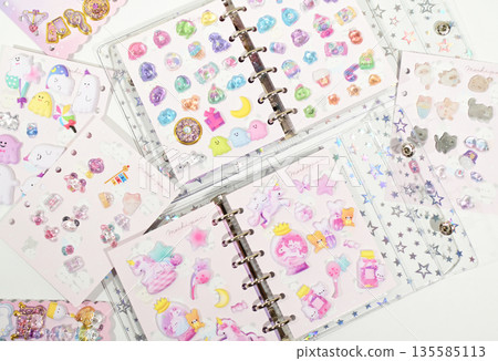 A sticker book filled with lots of stickers A sticker book filled with lots of stickers 135585113