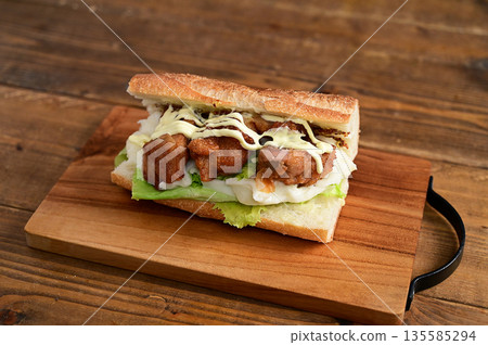 Fried chicken baguette sandwich Fried chicken baguette sandwich 135585294