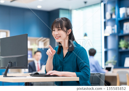 Businesswoman working in the office Businesswoman working in the office 135585852