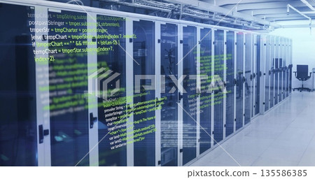 Showing server cabinets displaying blinking LEDs in data center with code panels and swivel chair 135586385