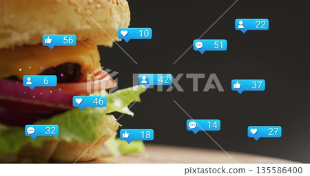 Showcasing cheeseburger with sesame bun and patty on wooden board, notification bubbles, copy space Showcasing cheeseburger with sesame bun and patty on wooden board, notification bubbles, copy space 135586400