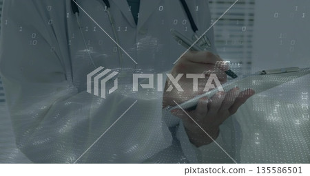 Writing doctor in white lab coat recording digital data in clinic with clipboard pen stethoscope 135586501