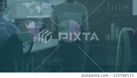 Presenting woman wearing suit holding tablet reviewing graphs in office, with monitors data overlay Presenting woman wearing suit holding tablet reviewing graphs in office, with monitors data overlay 135586513