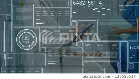 Doctors with stethoscopes reviewing on tablet and clipboard in clinic with floating panels, charts Doctors with stethoscopes reviewing on tablet and clipboard in clinic with floating panels, charts 135586537