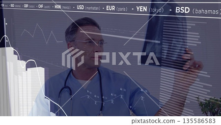 Doctor viewing X-ray film in clinic with stethoscope, eyeglasses, plant and financial data overlays Doctor viewing X-ray film in clinic with stethoscope, eyeglasses, plant and financial data overlays 135586583
