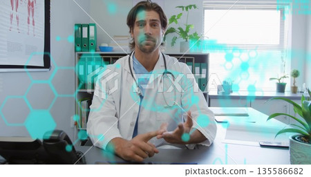 Counting finger points male doctor gesturing in clinic, with stethoscope, smartphone, data overlays Counting finger points male doctor gesturing in clinic, with stethoscope, smartphone, data overlays 135586682