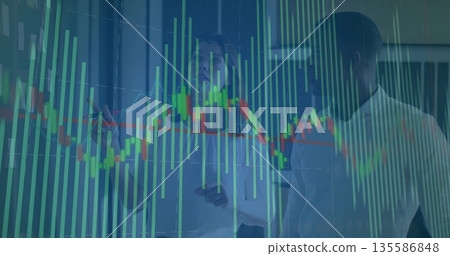 Gesturing strategist with marker and colleague discussing candlestick chart on glass wall in office 135586848