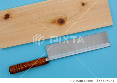 Light blue background and DIY materials of saw and cypress board 135586924