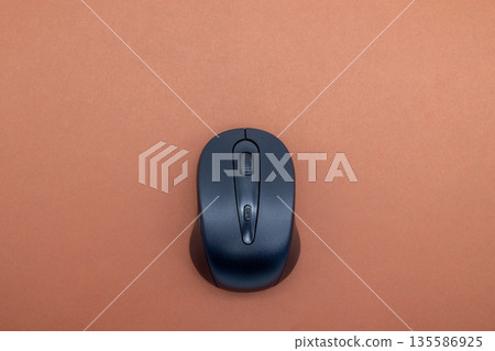 Brown background and wireless mouse 135586925