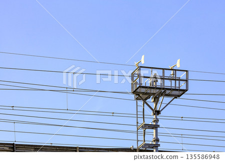 Blade type or Windmill type anemometer on top of the pole, with Platform for maintenance personnel. Blade type or Windmill type anemometer on top of the pole, with Platform for maintenance personnel. 135586948