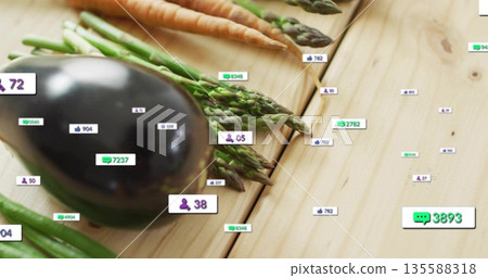 Showing eggplant, asparagus, carrots and beans with floating engagement badges on table, copy space 135588318