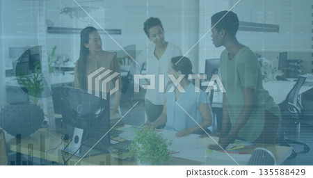 Collaborating four businesswomen in business casual reviewing diagrams in office, with monitor Collaborating four businesswomen in business casual reviewing diagrams in office, with monitor 135588429
