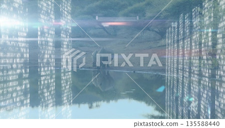 Standing lone rhinoceros reflecting in muddy watering hole, with glowing binary code and lens flare 135588440