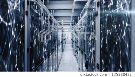 Data center aisle stretching between glass-doored server racks, with overhead cable trays Data center aisle stretching between glass-doored server racks, with overhead cable trays 135588482