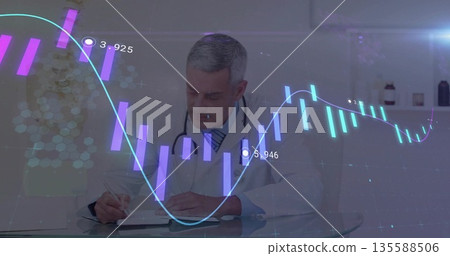 Writing doctor wearing coat, stethoscope, recording chart notes at glass desk, with hologram charts 135588506