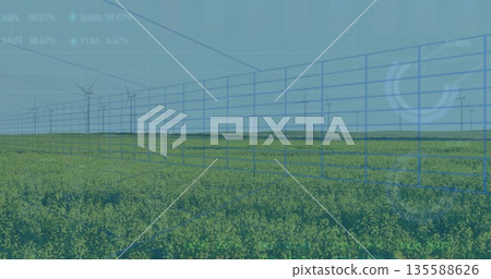 Displaying blue grid overlaying yellow field at farmland, with wind turbines and data graphs 135588626