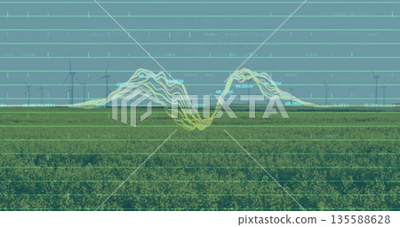 Displaying wind turbines and waveform graphs forming data overlay over green field under pale sky 135588628
