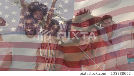 Cheering eight friends wearing sunglasses on sandy beach, with American flag graphic overlay Cheering eight friends wearing sunglasses on sandy beach, with American flag graphic overlay 135588692
