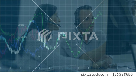 Analyzing financial data, traders collaborating at office desk with monitors and headsets Analyzing financial data, traders collaborating at office desk with monitors and headsets 135588696