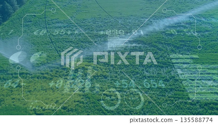 Spraying mobile sprinklers watering crop rows in rural farmland, with digital interface overlay Spraying mobile sprinklers watering crop rows in rural farmland, with digital interface overlay 135588774