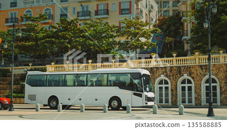Tourist coach bus in Sunset Town square, Phu Quoc Vietnam Tourist coach bus in Sunset Town square, Phu Quoc Vietnam 135588885