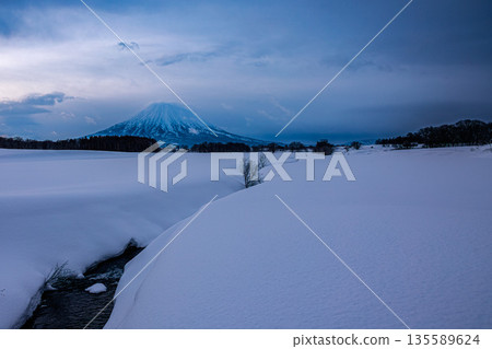 Mount Yotei shrouded in winter clouds - a magnificent view from Kutchan 135589624